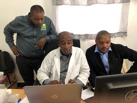Dr. Billy Haonga (left) has partnered with SIGN for almost 20 years. In 2021, he received his own Traveling SIGN Set. Dr. Haonga visits hospitals around Tanzania, instructing surgeons in the SIGN Technique.