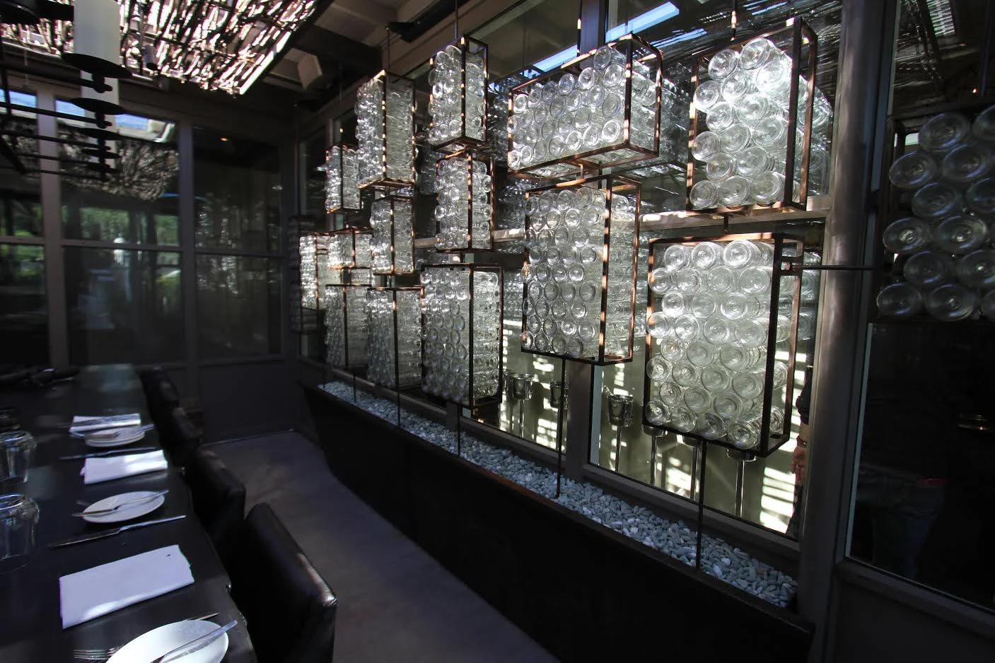 Custom glass and metal wall installation created for a restaurant/wine bar in Napa. We fabricated and assembled the glass components in this site specific piece.