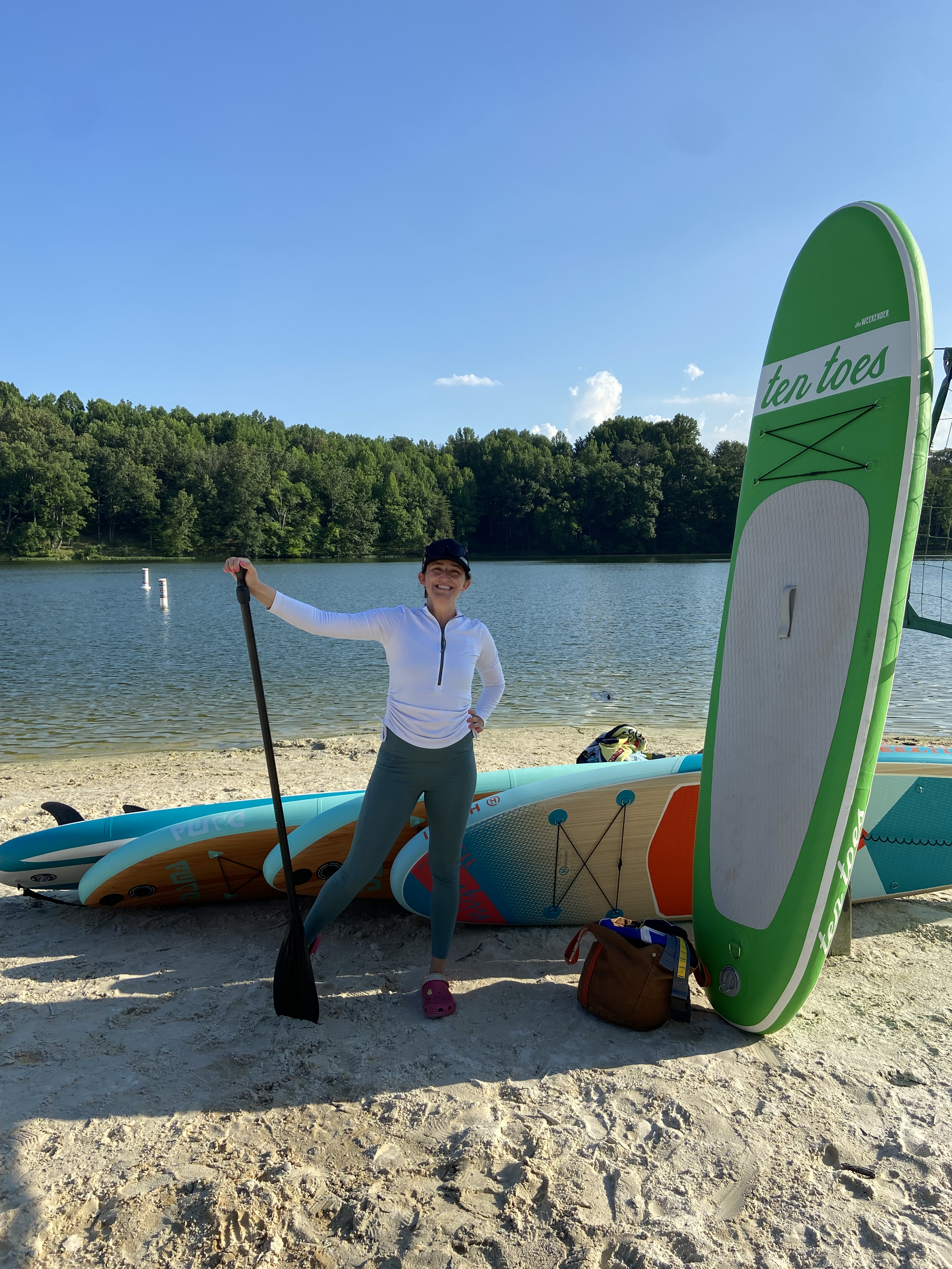 erica with sup board at lake.png