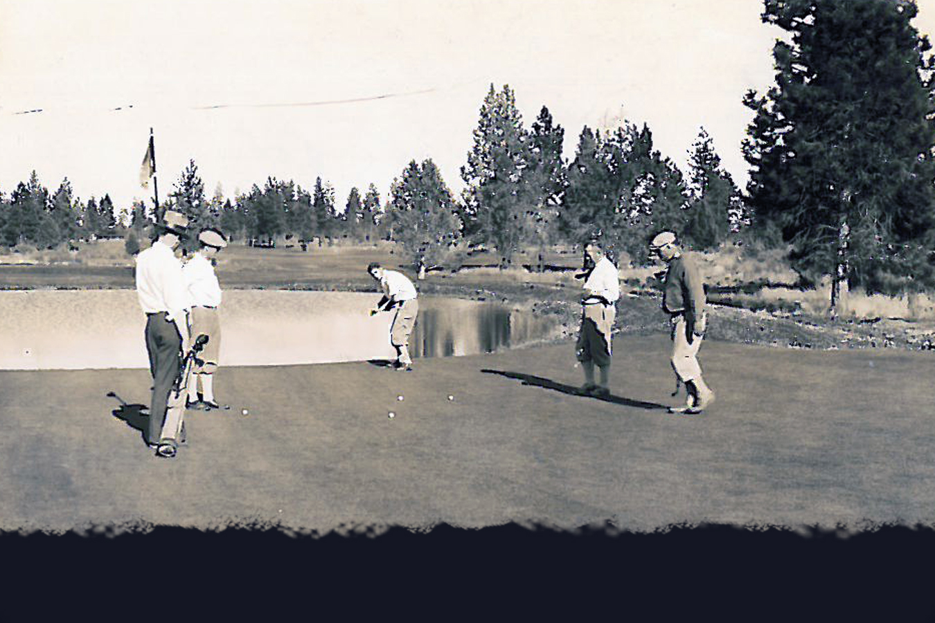  A foursome finishes putting on #11, which at the time of this photo was #7 on the original 9-hole course. 