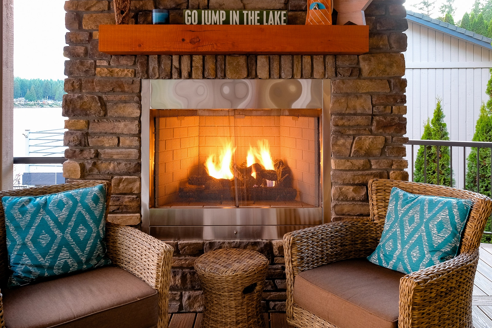   Covered &amp; Cozy Outside Propane Fireplace with Flush Stone Face &amp; Wood Mantle  