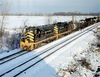 DECEMBER - On December 19, 1974, D&TS 43 and 46 are leading 63 cars westbound at Stanley Tower on the Toledo Terminal Railroad, another NKP affiliate. - D.R. McCulloch photo, Thos Gascoigne collection