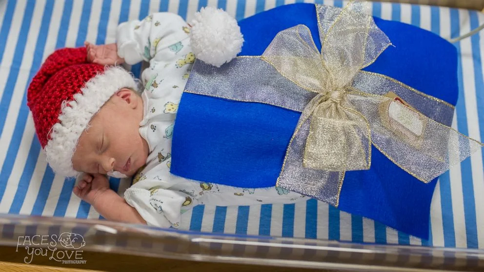 (Faces You Love Photography/March of Dimes) Santa turned the babies in the NICU at Saint Luke's Hospital of Kansas City into tiny "gifts" this holiday season.