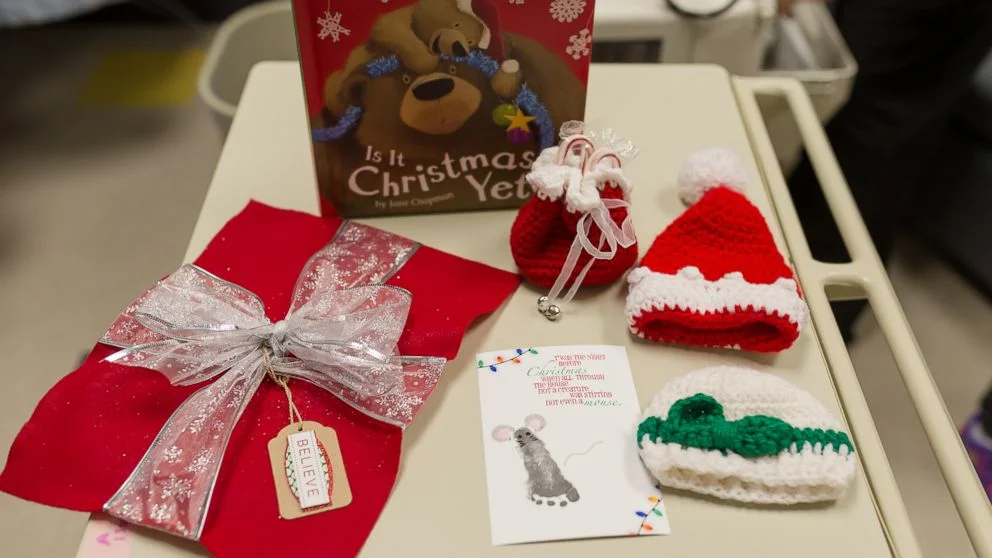 (Faces You Love Photography/March of Dimes) Santa turned the babies in the NICU at Saint Luke's Hospital of Kansas City into tiny "gifts" this holiday season.