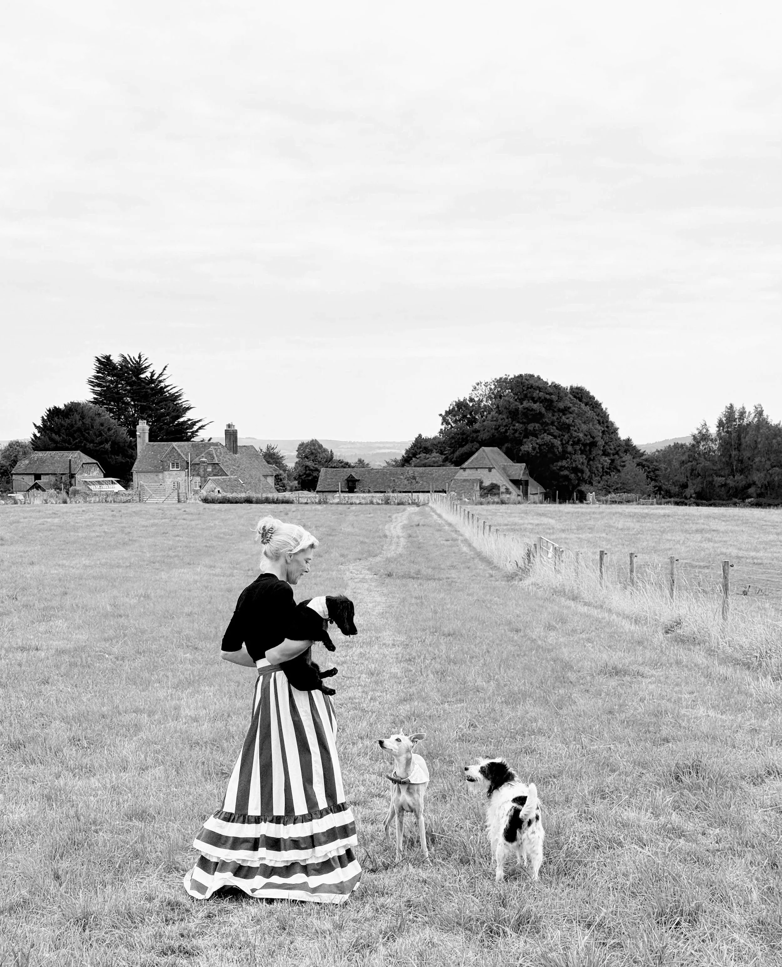 woman with dogs, fashion, cool, long skirt, blonde, designer, elegance, chic, British, countryside, Sussex