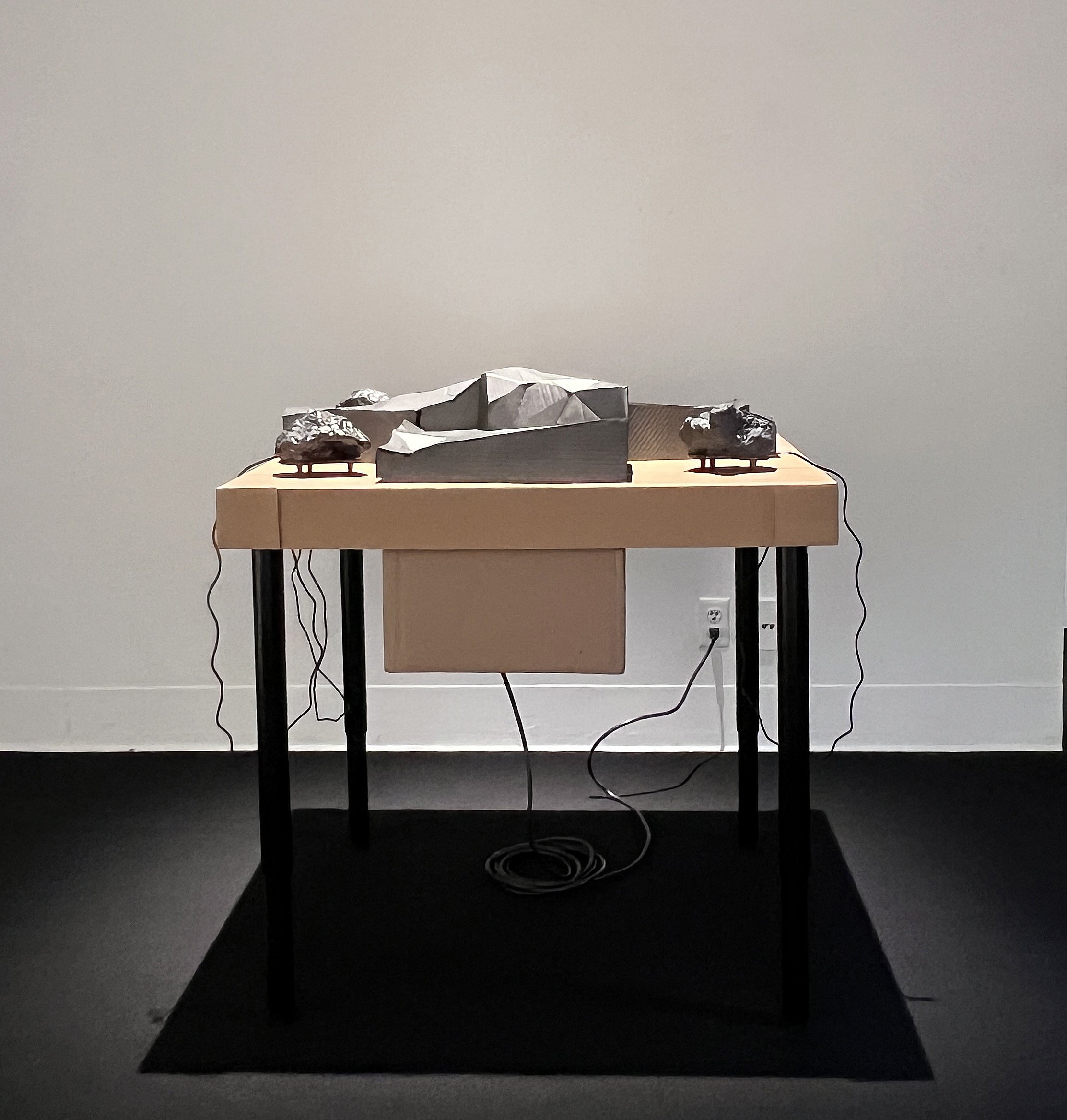   Emerging Landforms   Cardboard, graphite, rocks cast in ceramic, bone conduction speaker, Sound: Białowieża Forest thunder, meltwater, Svalbard walrus, frogs, kittiwake rookery, morning chorus, hummingbird 