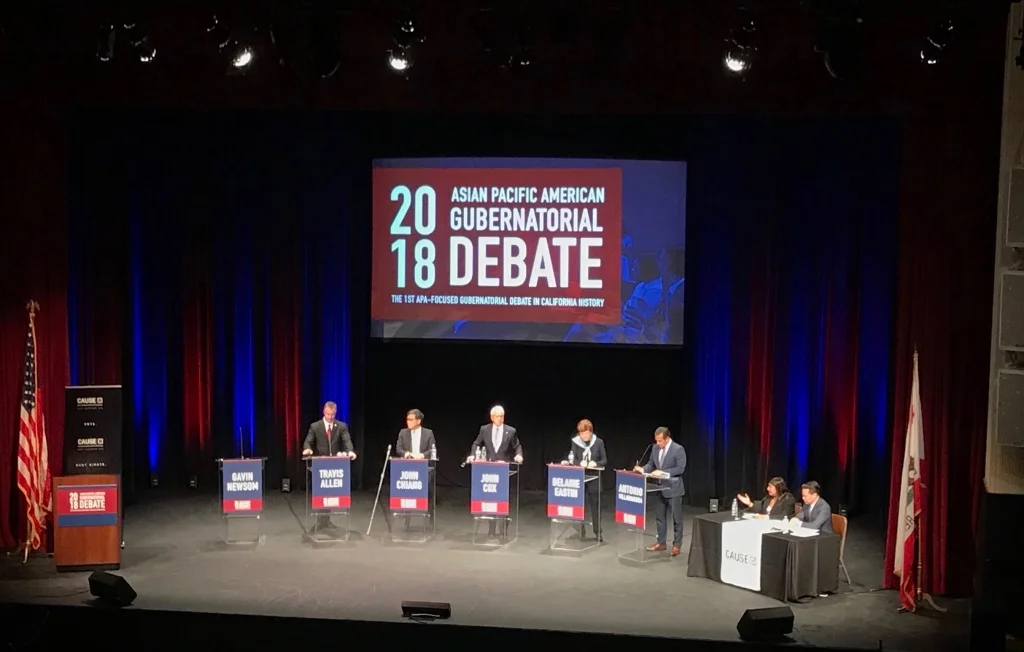 An empty lectern for gubernatorial candidate Gavin Newsom made clear what the organizers of the Asian Pacific Islander debate on Friday in Pasadena thought of his absence. MARY PLUMMER/KPCC