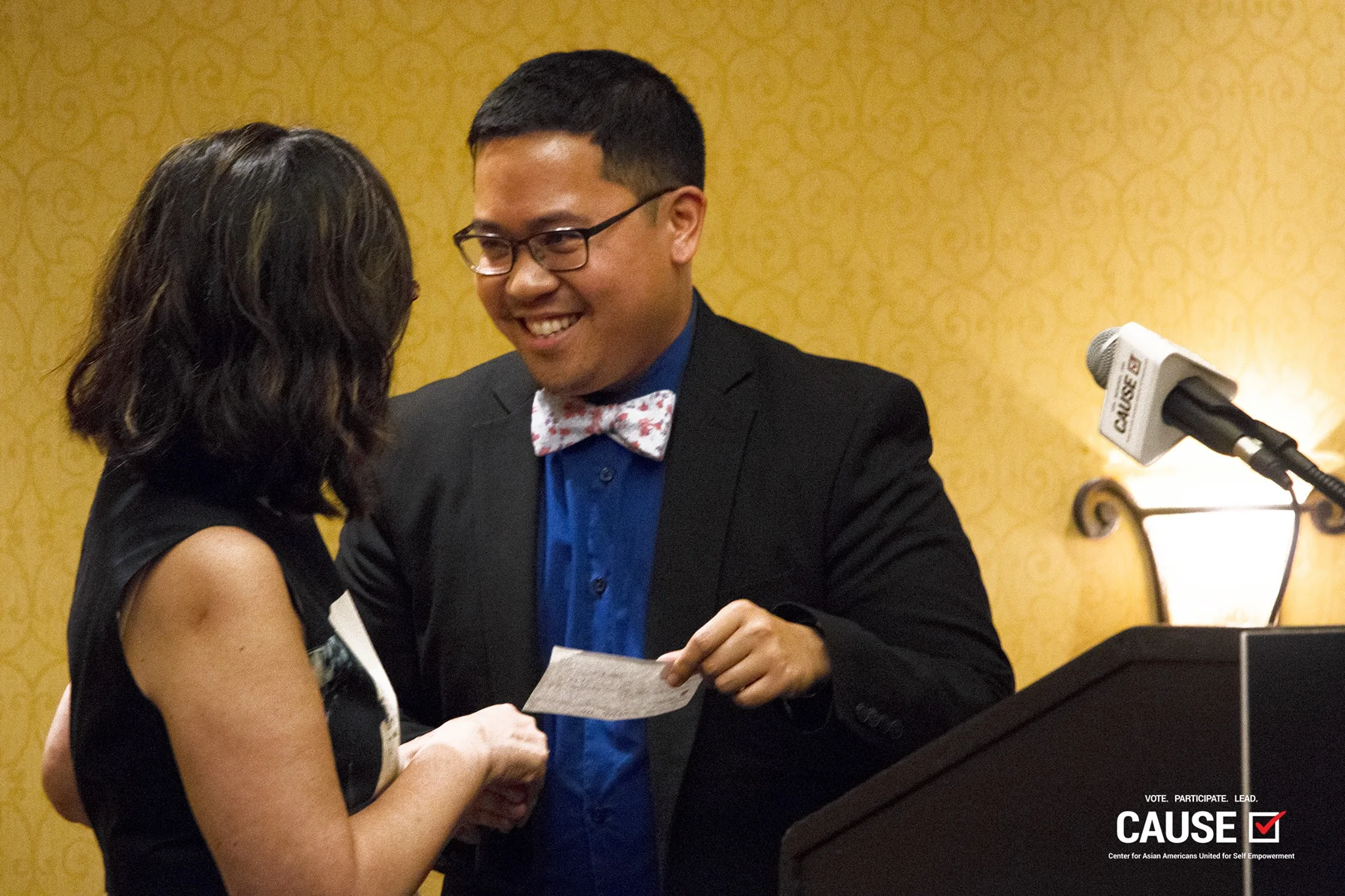 AndyMike presents the funds raised by the 2018 CAUSE Leadership Institute to Asians and Pacific Islanders with Disabilities of California