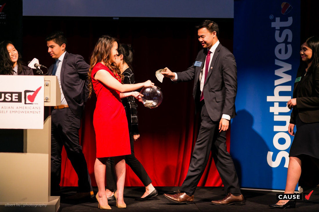 Kim Yamasaki accepting donations for CAUSE at the 2016 CAUSE Leadership Academy Graduation