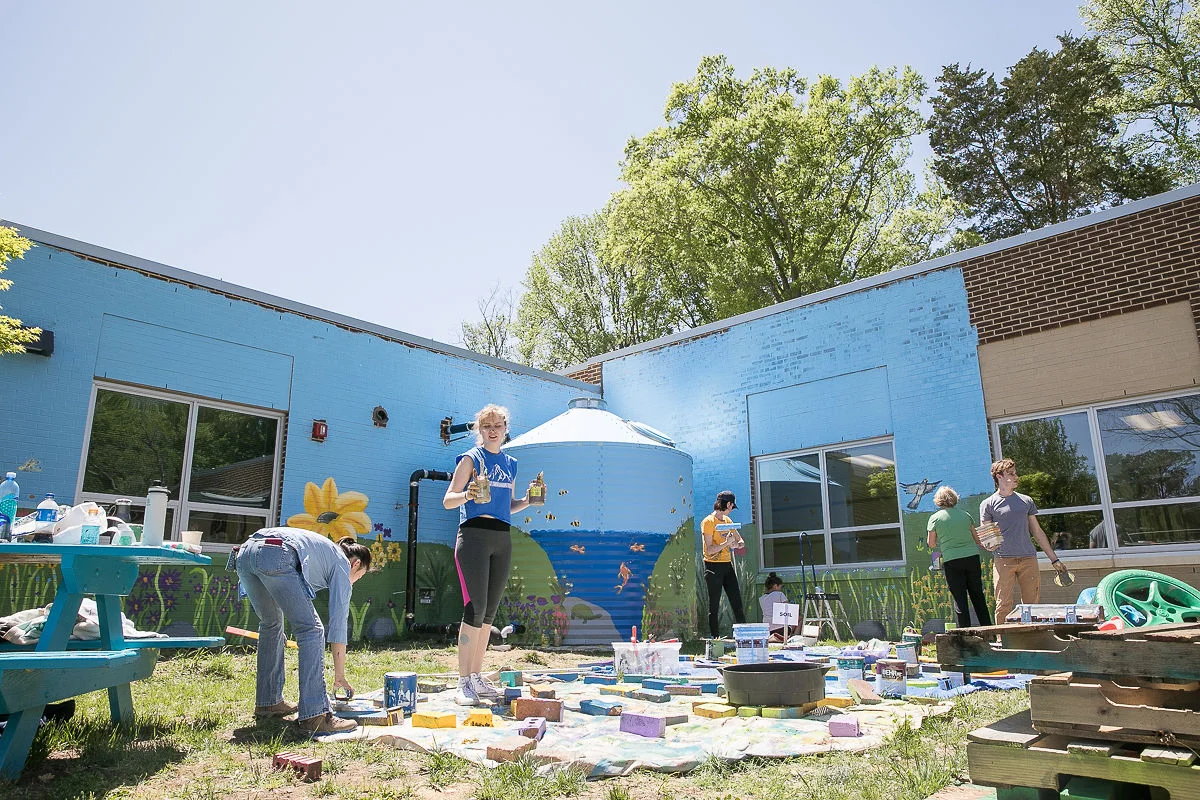 Photography by Jin - All hands on deck painting a 3D mural in the Outdoor Classroom