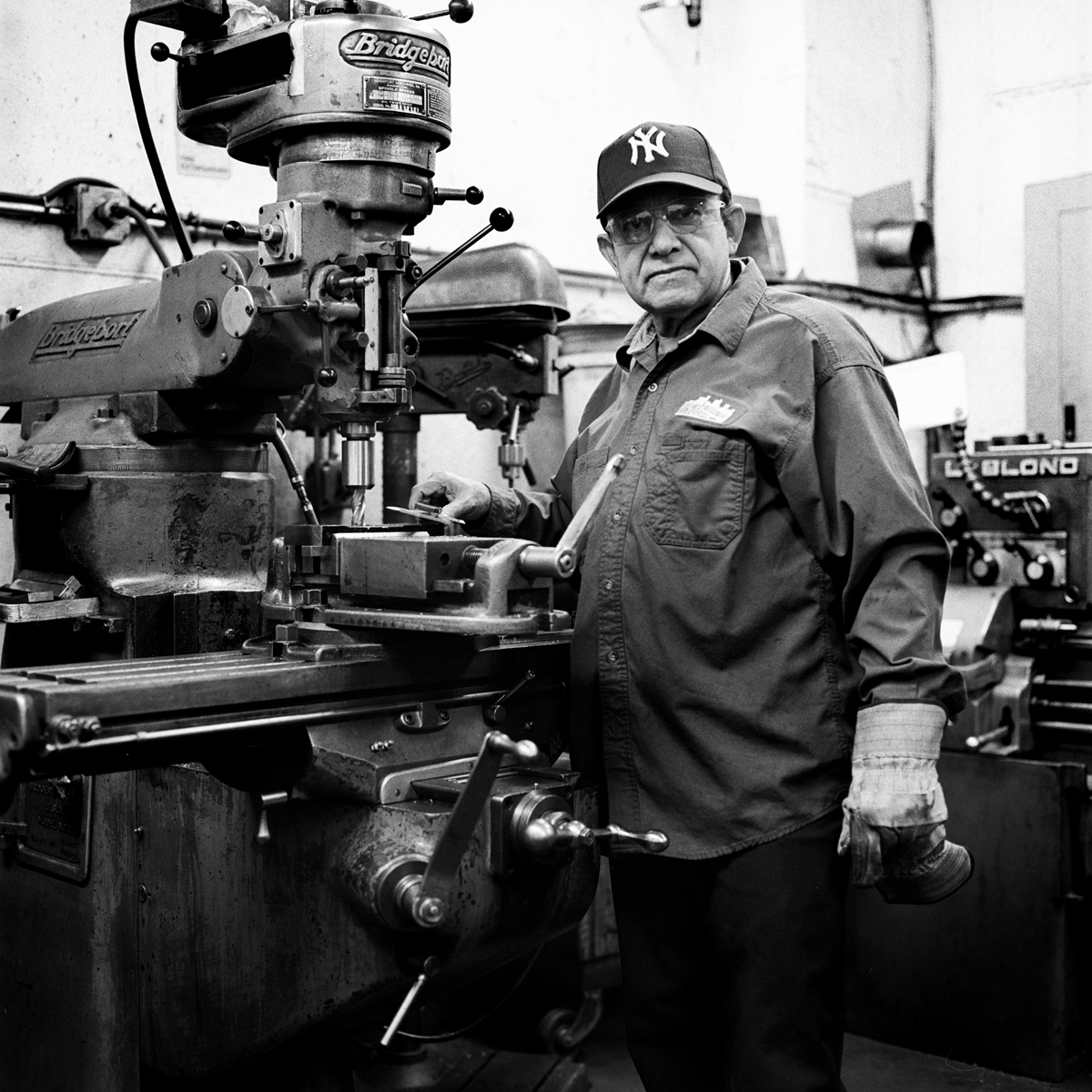  Mario, Reinforcing Supply’s shop machinist, by his driller. The machinery used at Reinforcing Supply are all built and maintained in house.  Williamsburg, Brooklyn, N.Y. (Nov. 2015) 