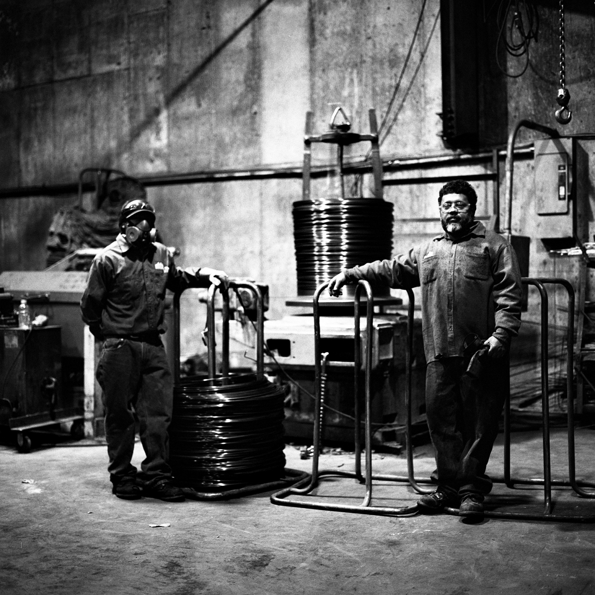  Angel (left) and Wilfredo, wire straighteners, at their post at Reinforcing Supply.  Wiliamsburg, Brooklyn, N.Y. (Nov. 2015) 