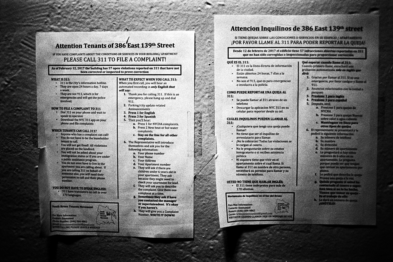  311 sheets located on each floor to remind tenants to call if their landlord lacks to provide heat, finish repairs, or any other services. Mott Haven, Bronx, N.Y. (May 2017) 