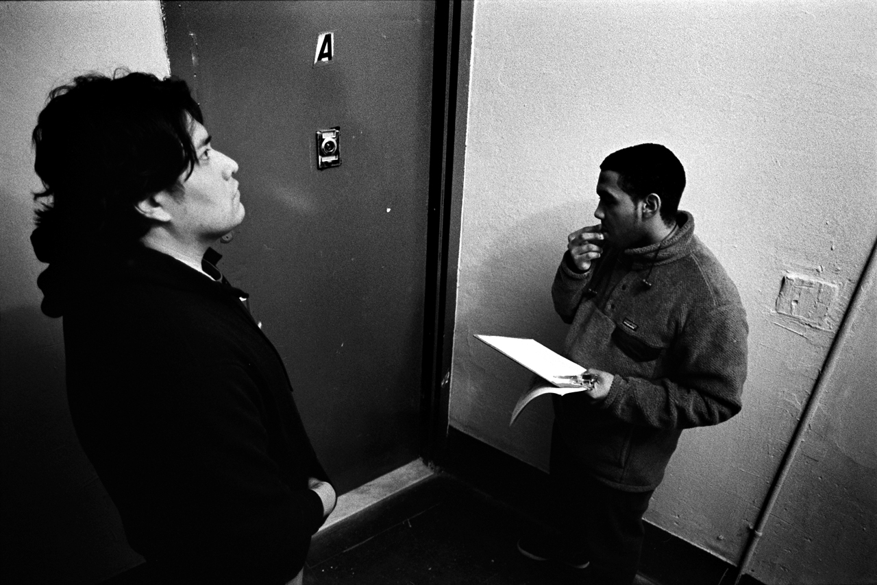  Tenant organizer, Emmanuel Pardilla, and 386 E. 139th Street tenant, Roy Cano, conducting an evening of door knocking to announce an upcoming tenant meeting. Mott Haven, Bronx, N.Y. (March 2018) 