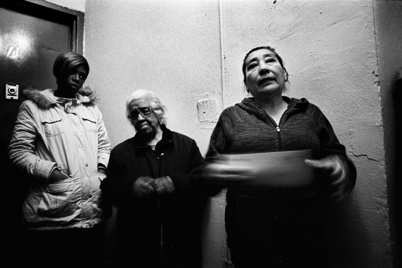  Tenant Juana Cano deliberating the issues that she has in her apartment while introducing herself at a tenant meeting with lawyers from the Urban Justice Center in the lobby of 386 E. 139th Street. Mott Haven, Bronx, N.Y. (March 2018) 