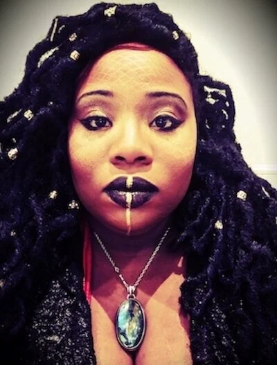 RAWIYAH TARIQ, READER      (They/Them)     Rawiyah  is a witch, healer, art activist, and storyteller. For over a decade, Rawiyah has woven music with spoken word and song to create cathartic pieces that center Blackness, Fatness and Queerness. A former member of the award winning and internationally traveled troupe Rubenesque Burlesque and co-founder and lead of  A Sovereign Embodiment  they continue to highlight body and soul liberation in their solo career. Their art is often political /ritual and is rooted in a vulnerability that can be both humorous and heartbreaking. For information, bookings and connects find them at  www.mammyisdead.com.