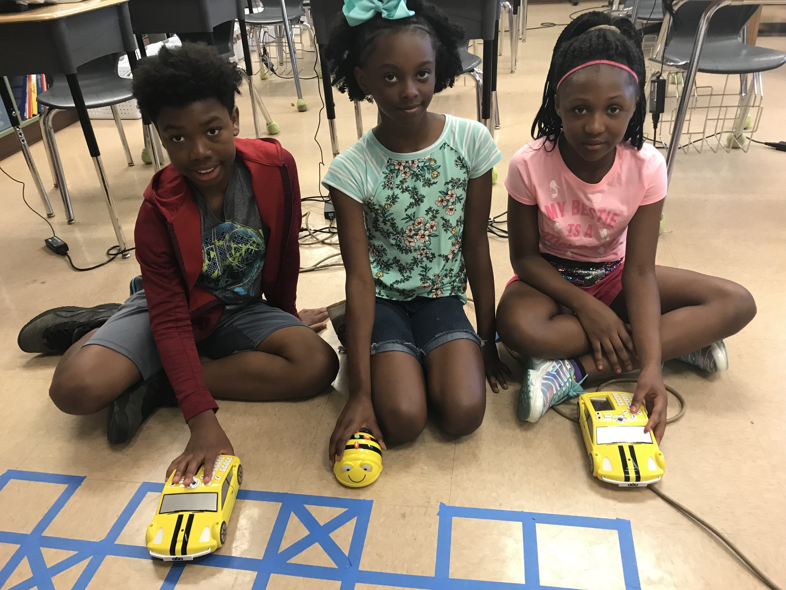 3 students on floor w grid.jpg