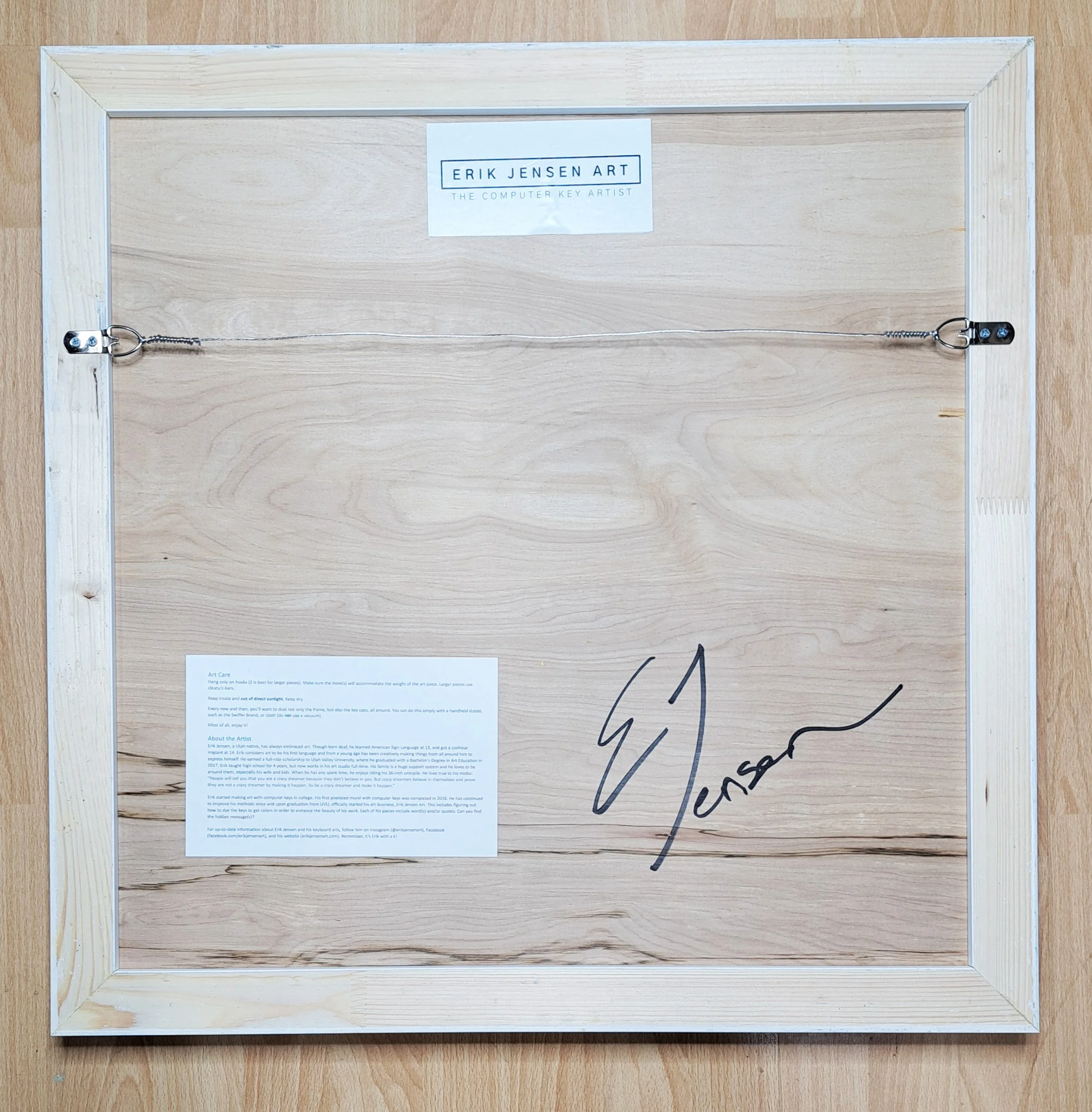 Sample backing shows wiring, artist logo and signature, as well as care info.