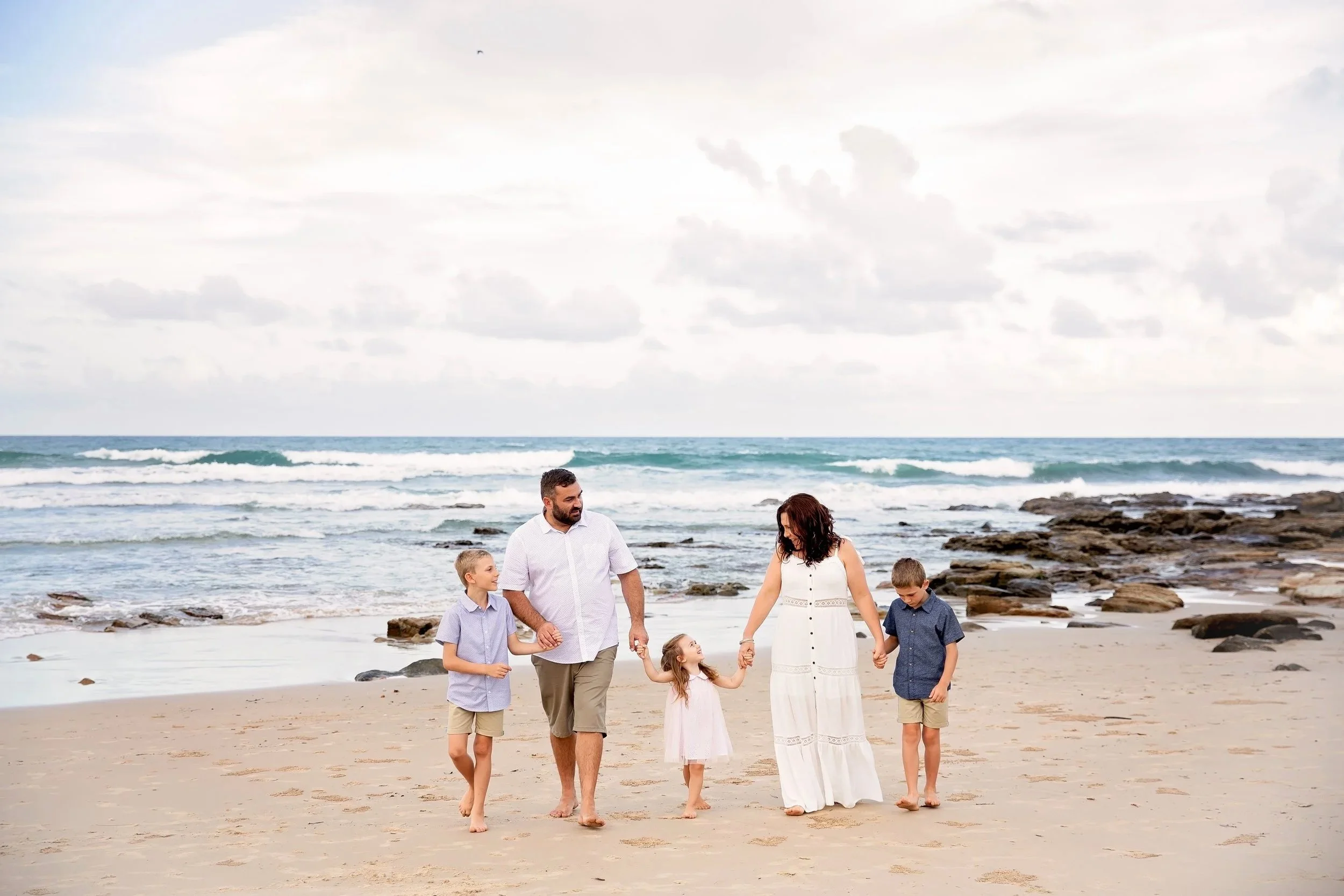 "My hubby and I were so incredibly grateful for the candid photographs Yelena took. With 3 kids in the picture we were looking for someone easy going, but professional, and that's exactly what we found. She had the ability to make our kids laugh and 