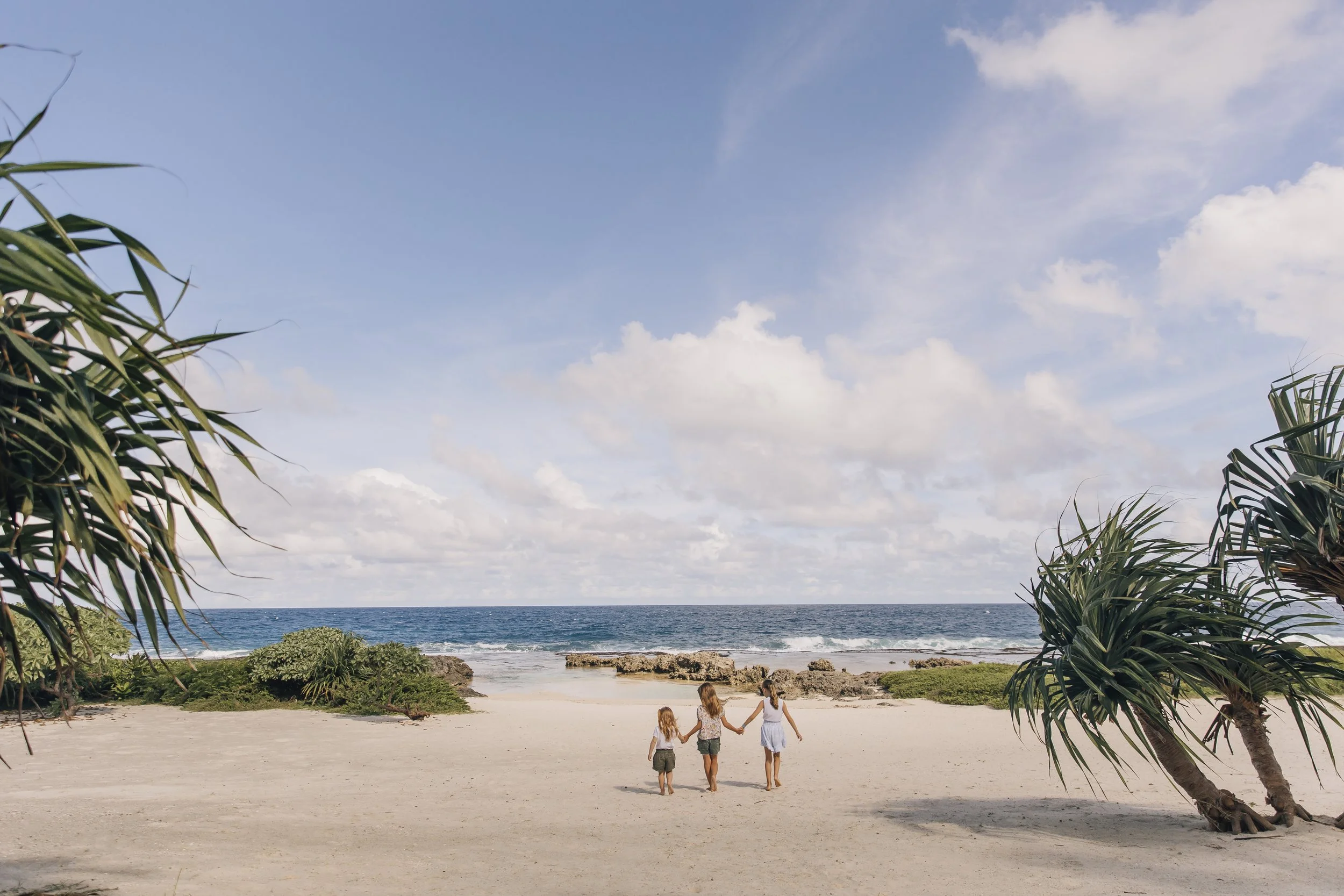 kids running on the beach