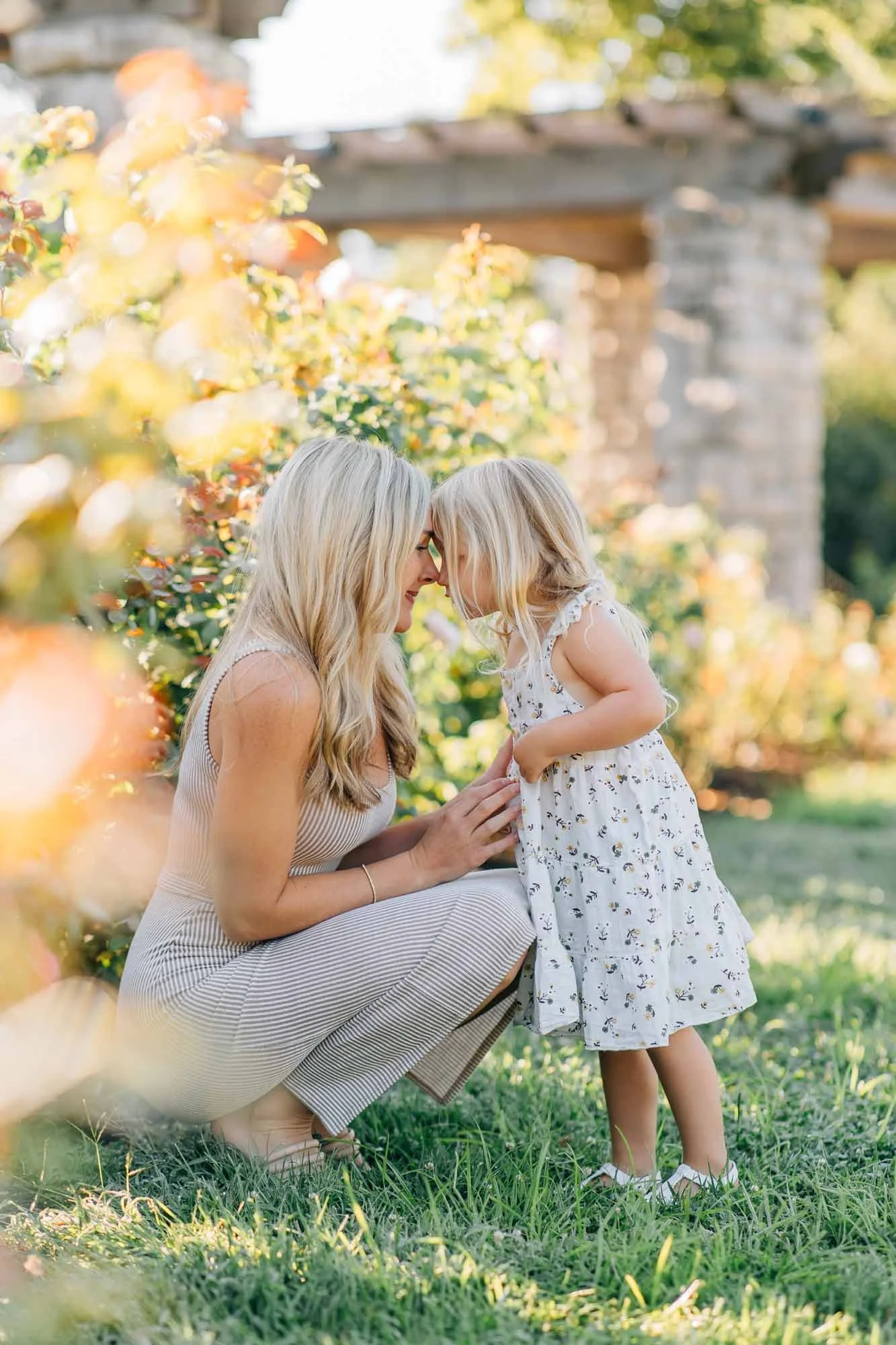 mom and daughter cute portrait in the summer