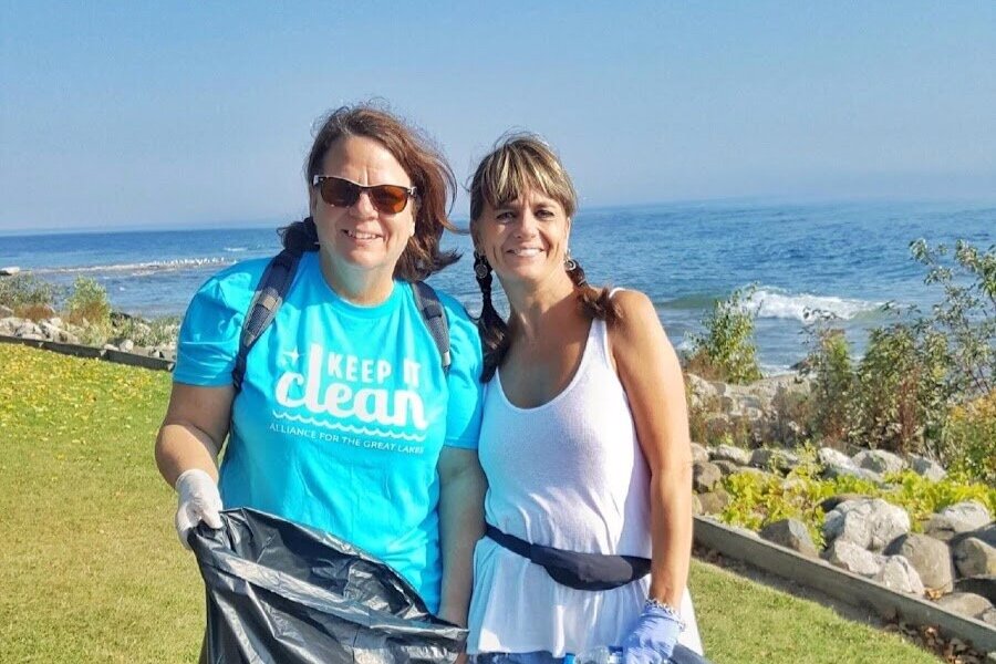 FONP co-leader, Starr Gerk, and a volunteer cleanup North Point last summer.