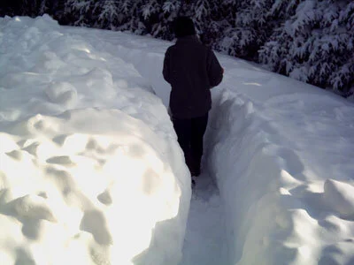 Waist-deep snow outside the cabin