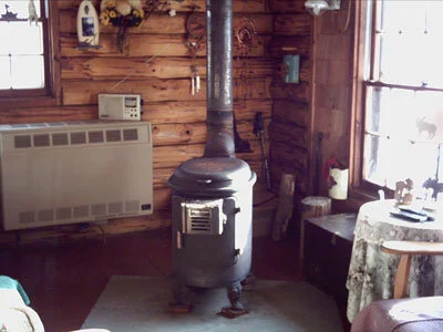 The fire in the woodstove turned the chimney to a glow, while the temperature outside fell to twelve below . . .