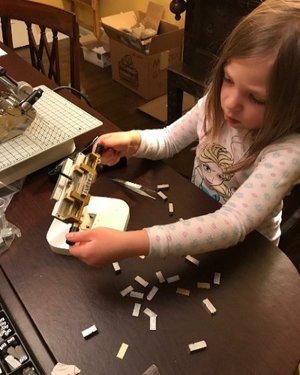 Bea helping with some behind the scenes journal embossing