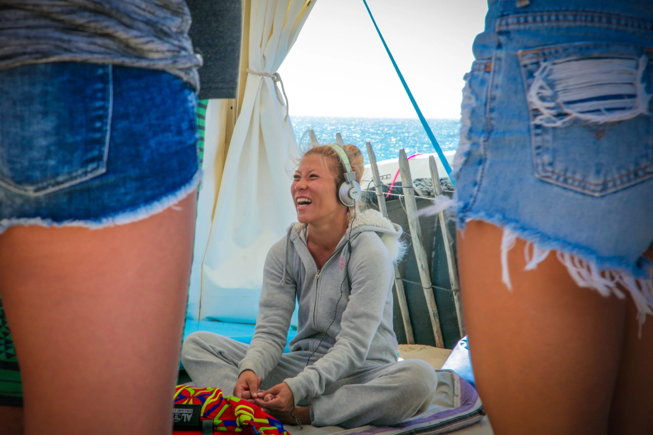 2016_France_IMG_1589_AngeleeSitsOnBeachLaughing.jpg
