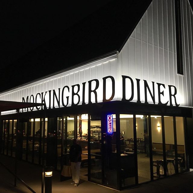 Illuminated signage at Mockingbird Diner