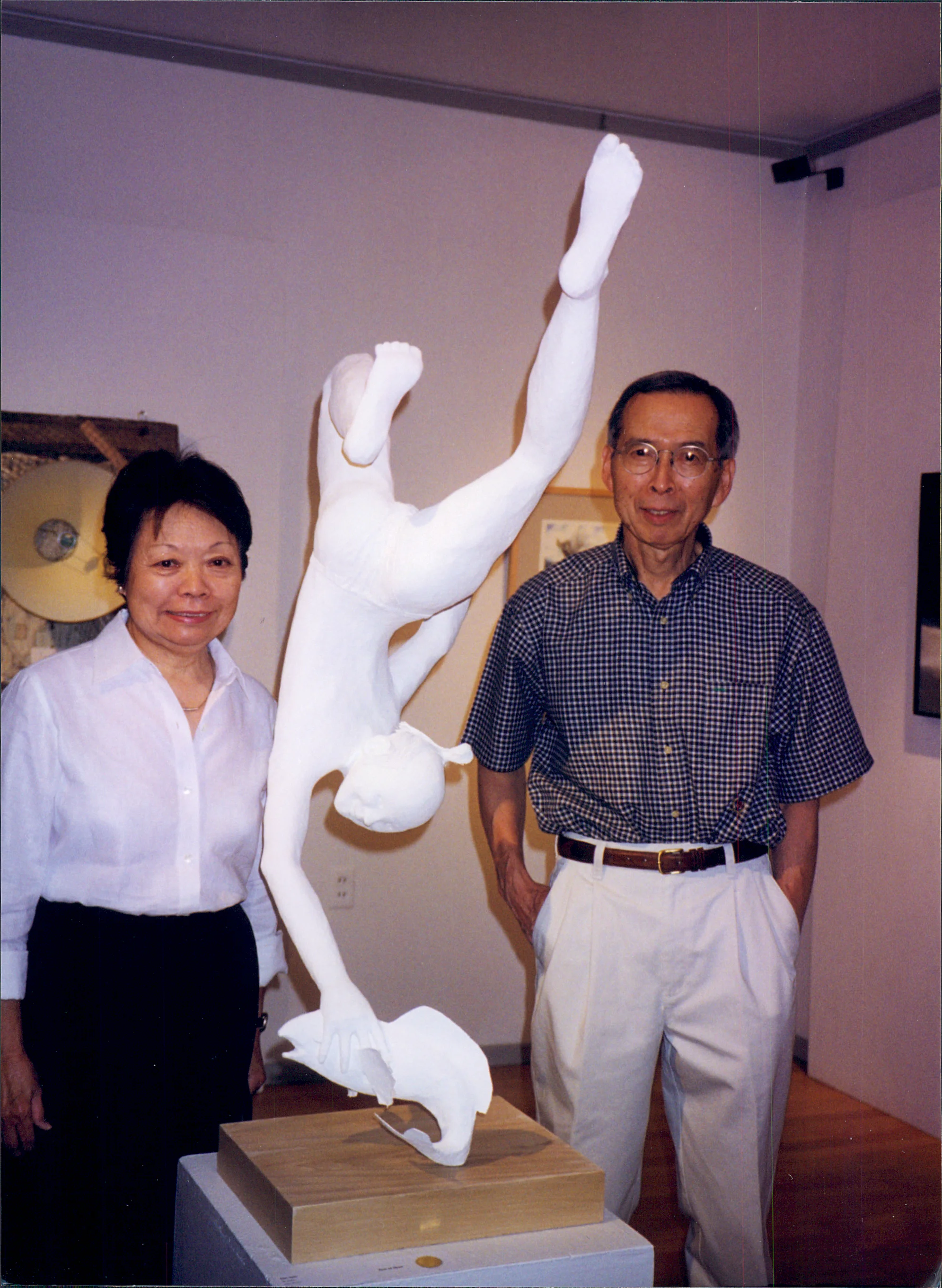 Ann and her paper mâché sculpture at an art gallery show.