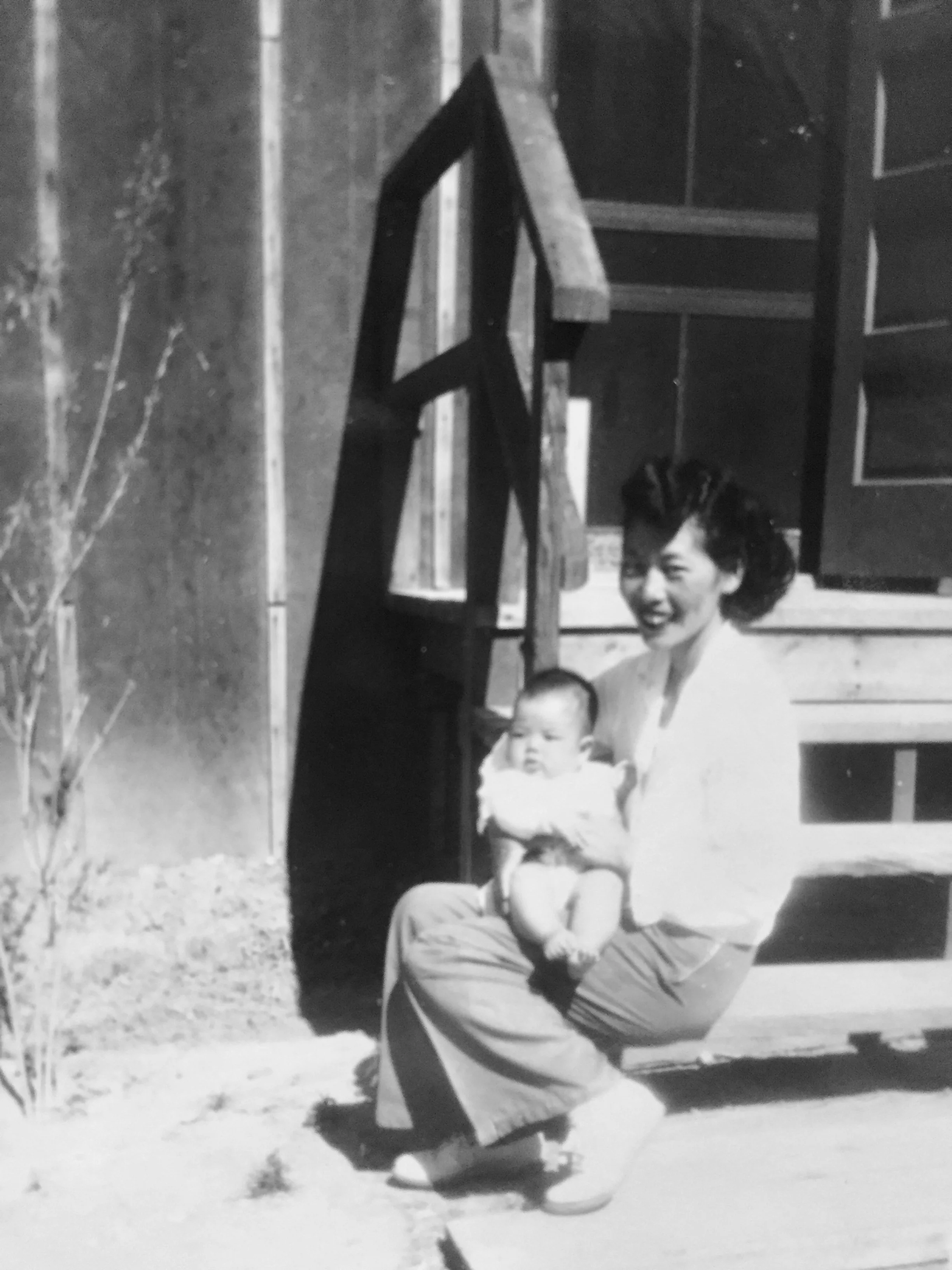 Tommy and her first child, Janice, in Heart Mountain