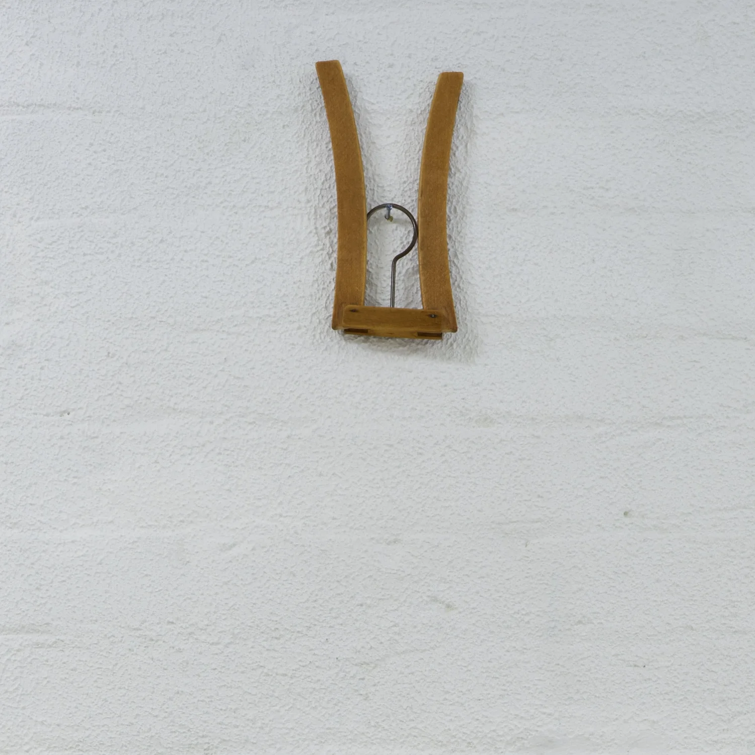 Bridget Currie, A hanger from my collection (folding wood hanger), date unknown, Lithuanian. Wood and metal.