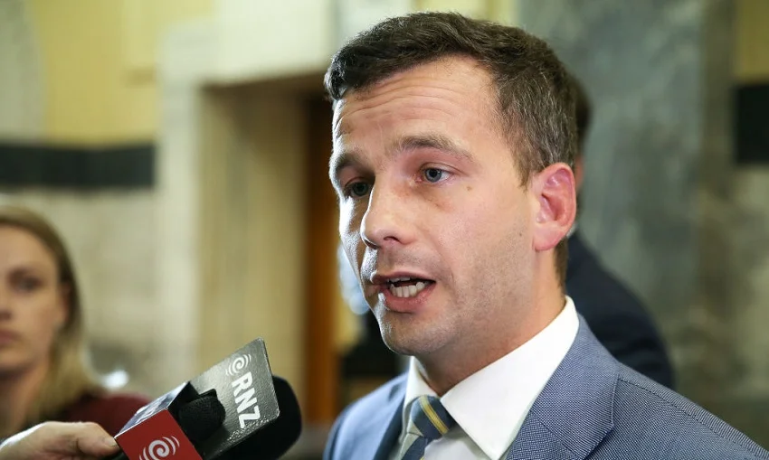 ACT leader David Seymour speaks to media on his way to the House at Parliament (Photo by Hagen Hopkins/Getty Images).