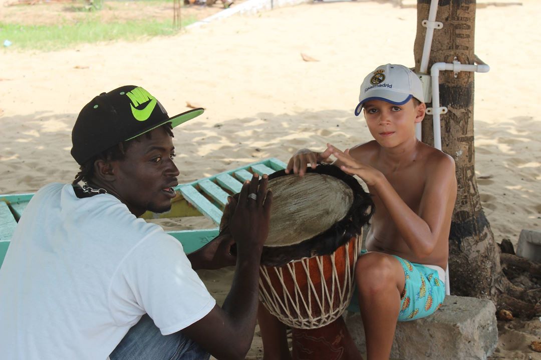 A drum lesson while hanging with the locals