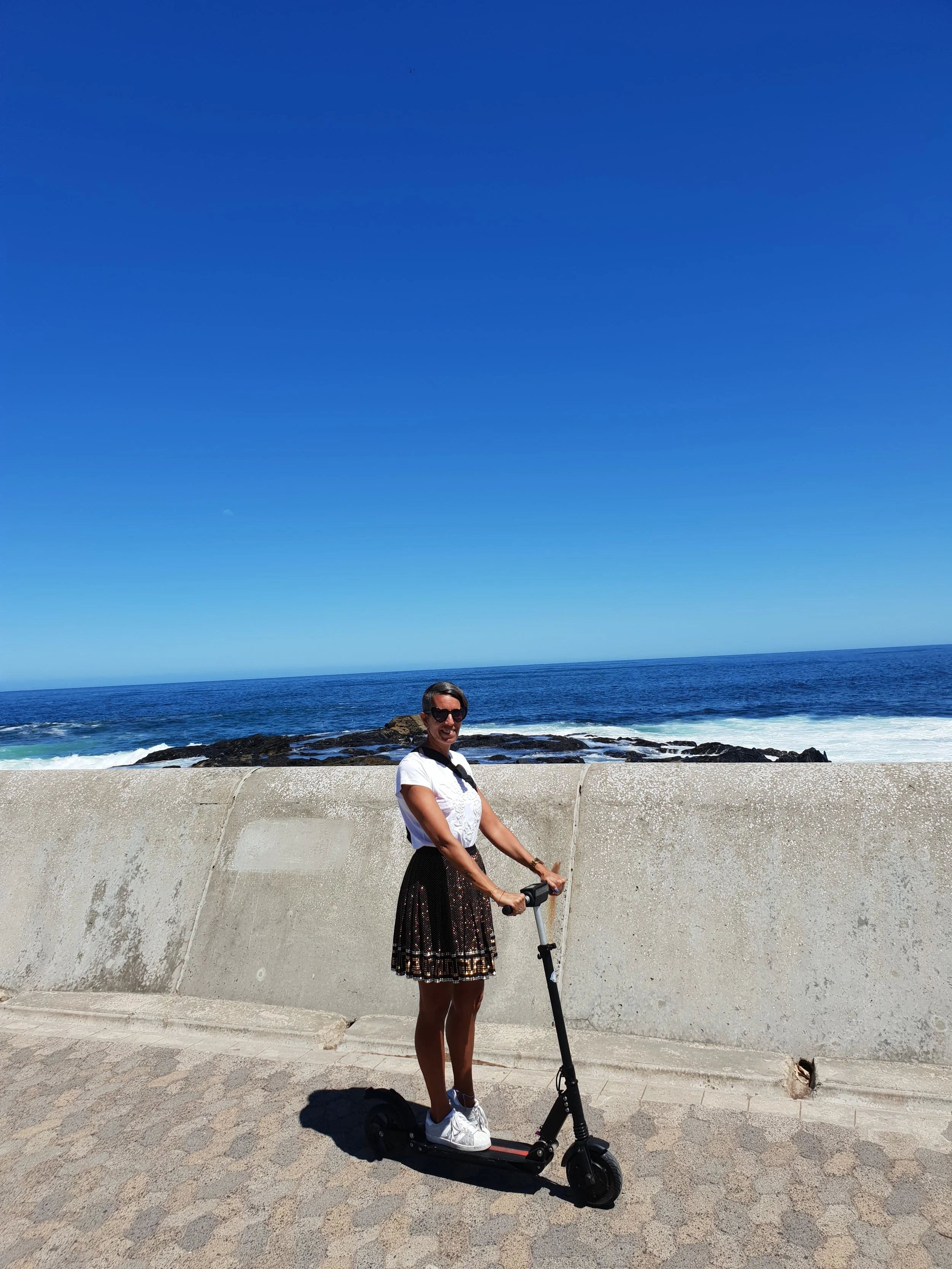 Racing down the Sea Point promanade on my electric step