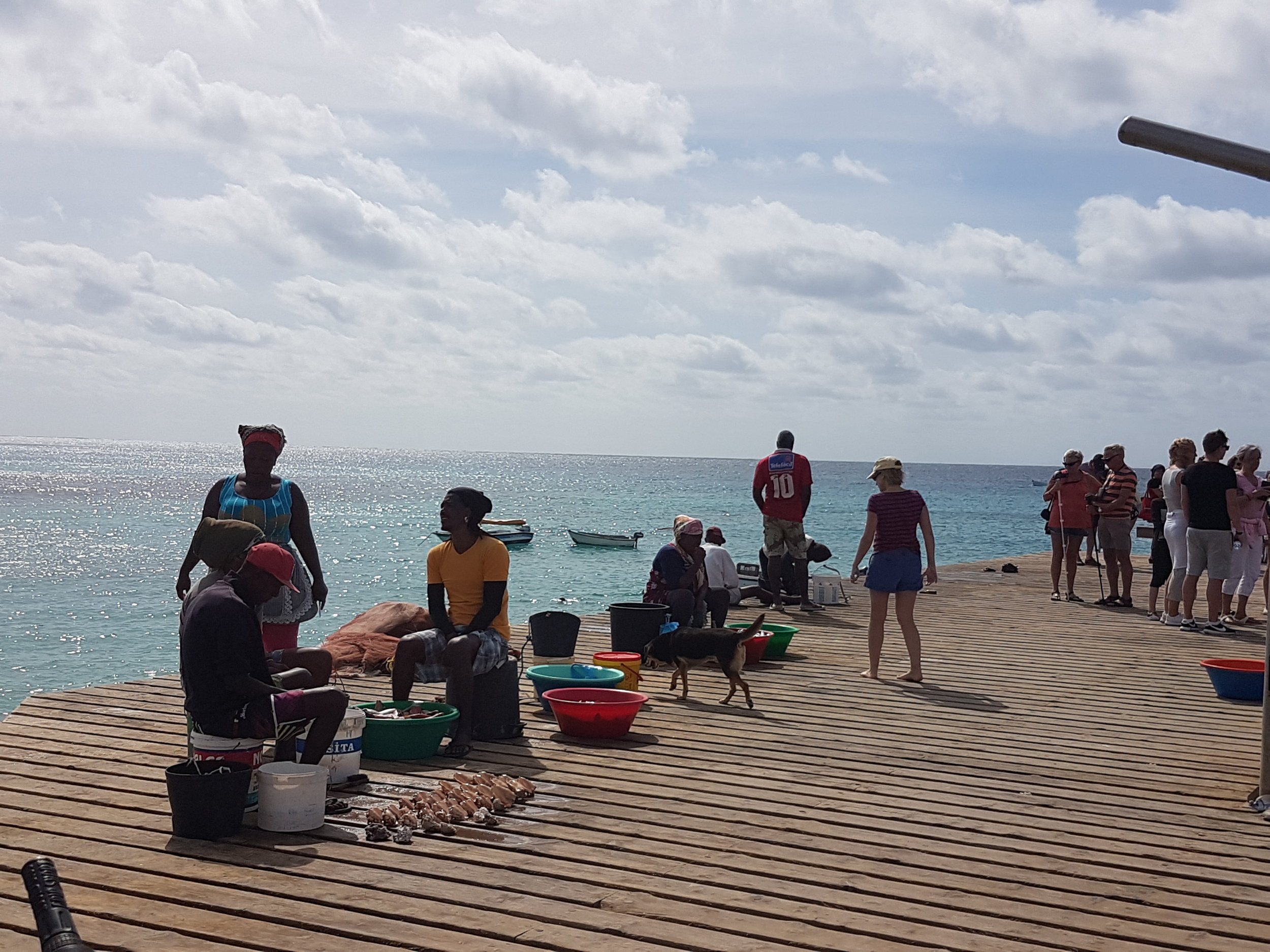 The fishermen selling their goods right there on the pier in Santa Maria