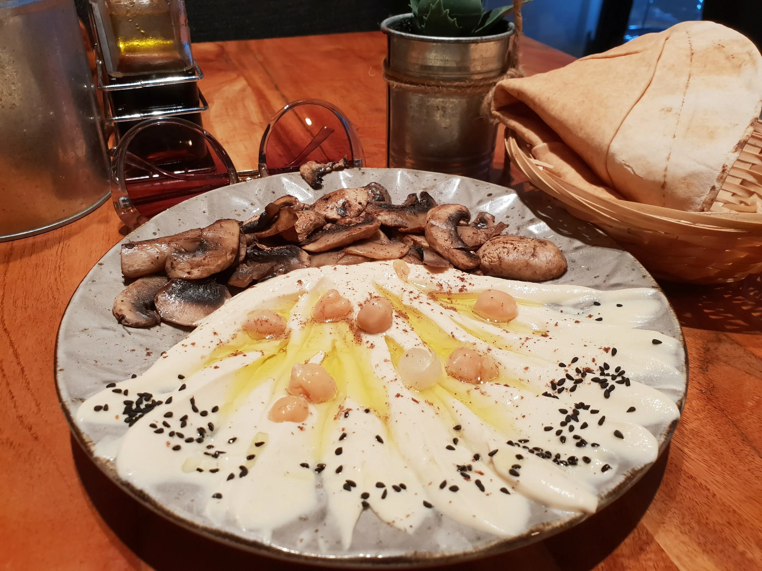Hummus served with mushrooms. There are 5 different ways hummus is served here and all are delish!