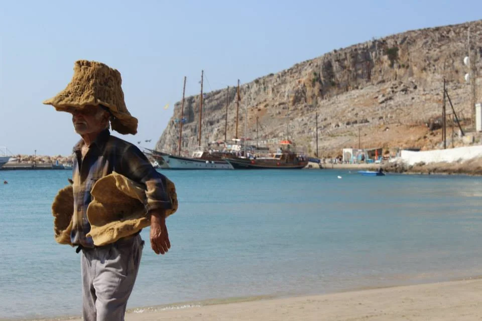 Selling sponges on Pserimos Island, Greece