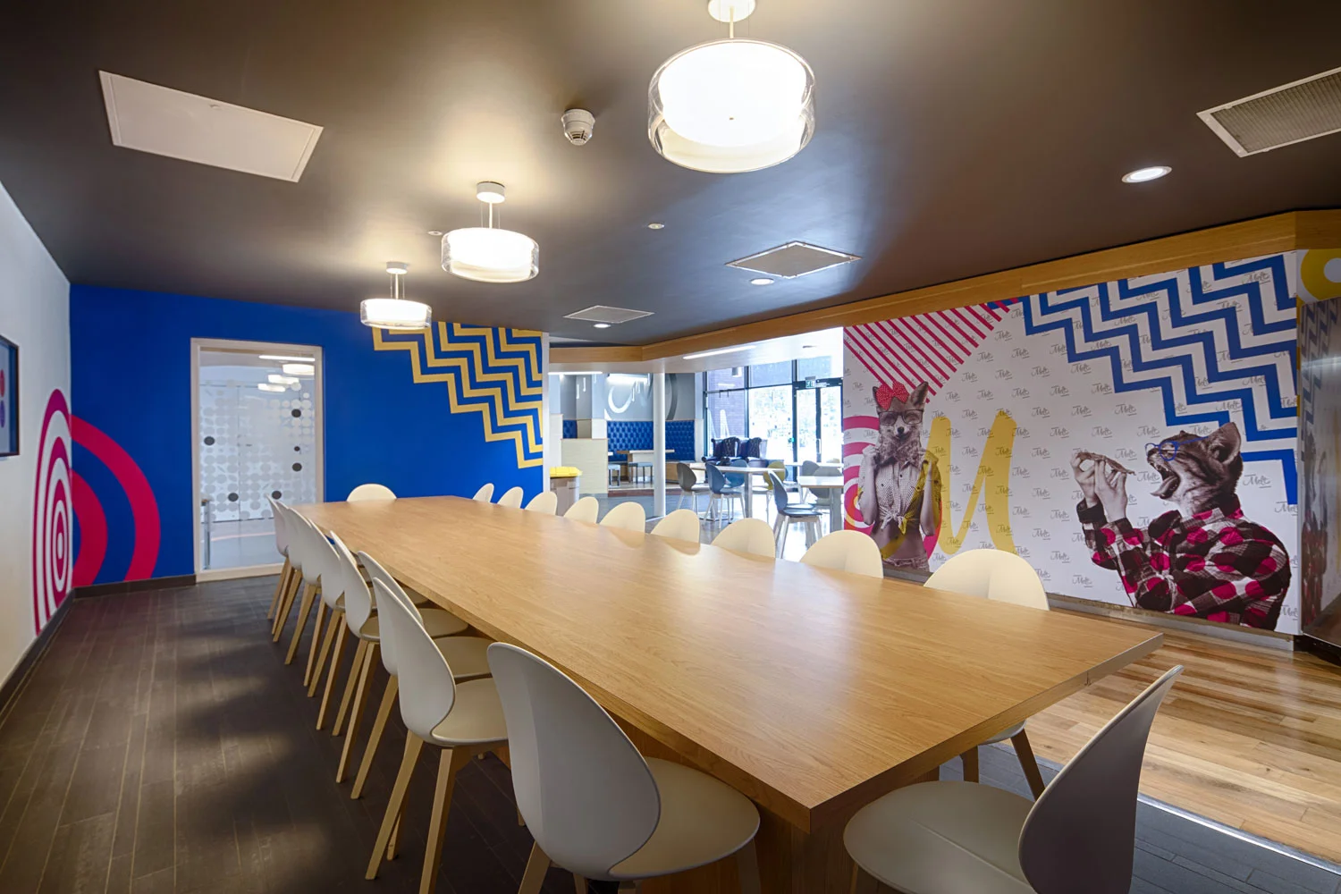 Dining area with bold bright wall graphics