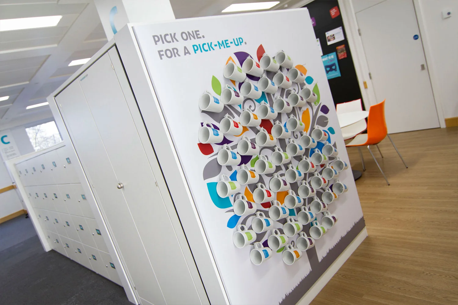 Vinyl wall graphic tree with multi coloured leaves with staff mugs