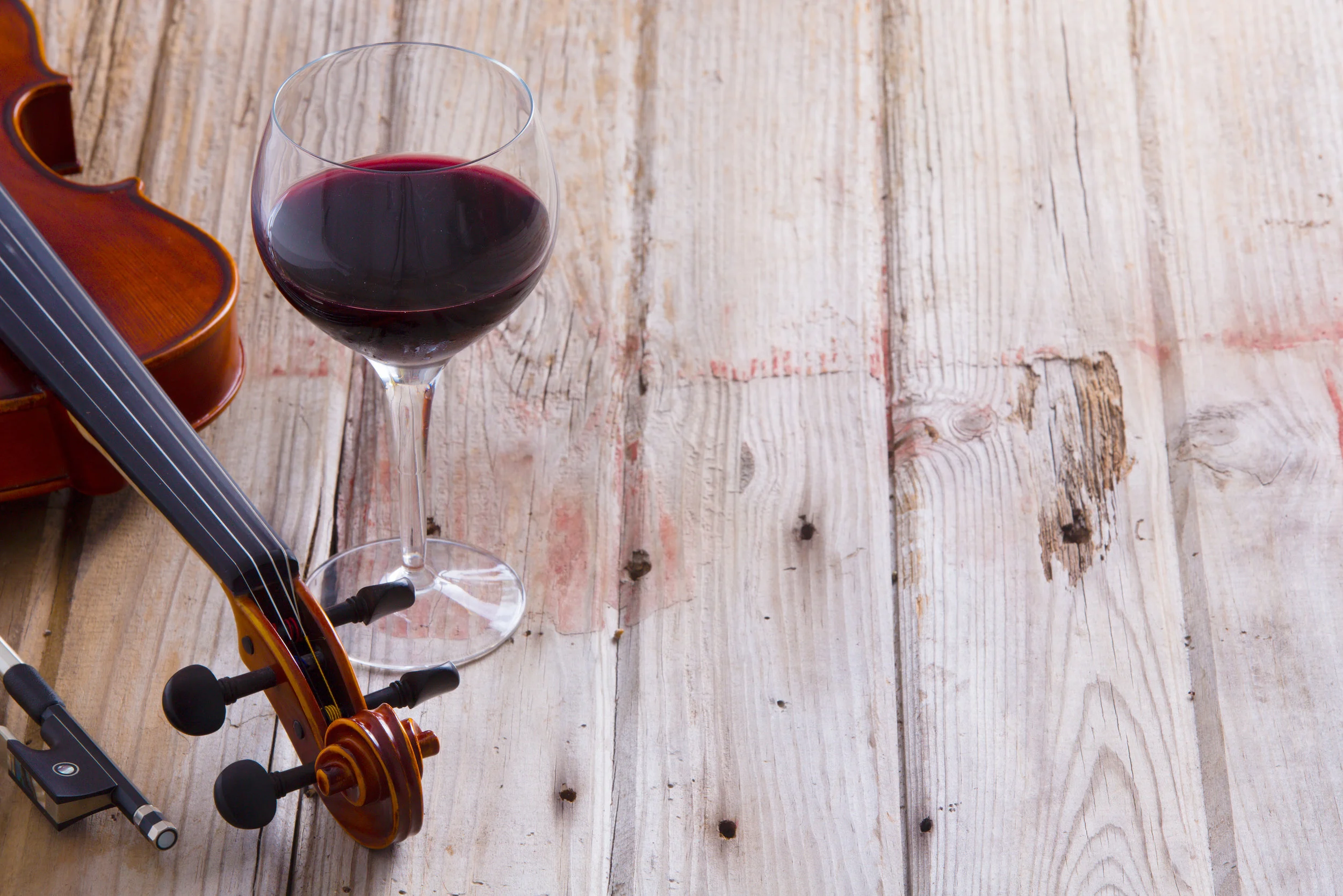 bigstock-Violin-And-Wine-On-Wooden-Floo-106630013.jpg