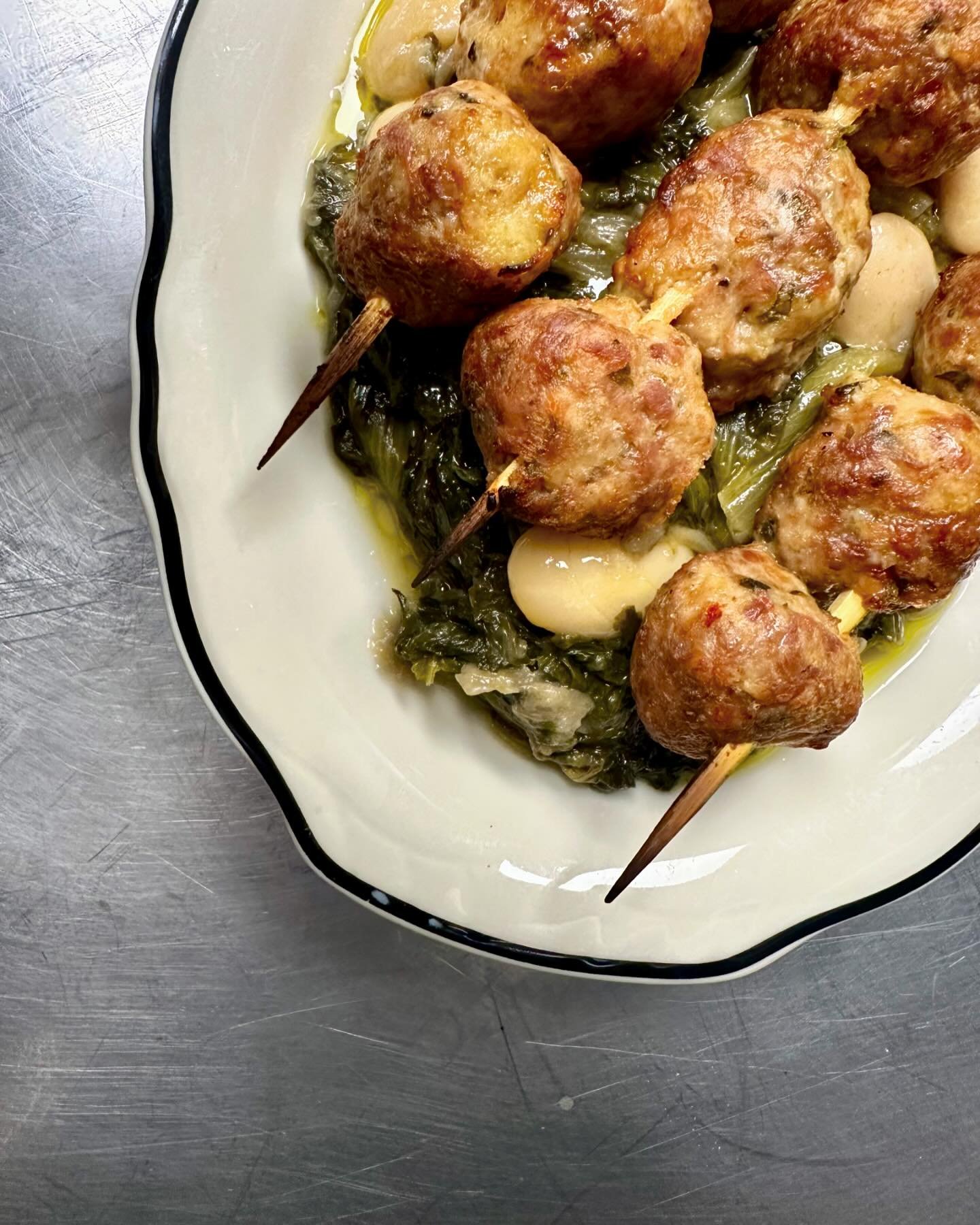 Channeling the old country here. Tender meatball spiedini, absolutely hammered (50 shades of grey) escarole with some Gigante beans and plenty of some fine as frog hair olive oil from @groveandvine Happy Sunday amici!
.
.
.
#meatball #spiedini #escar