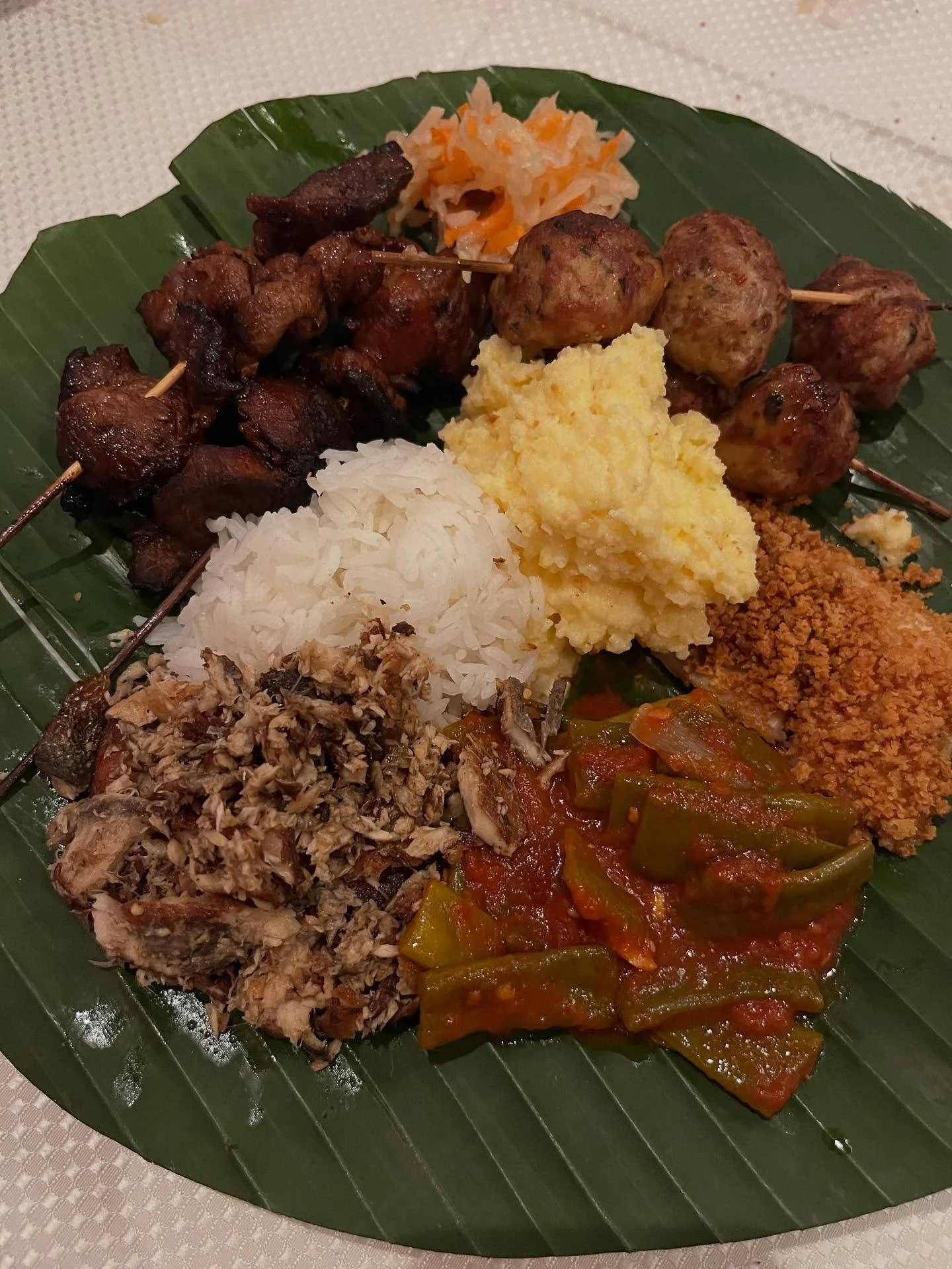 A humble photo of humble food for a great cause. @karenderya_ny @louiesnextdoor @dpnbpastashop all teamed up to cook for @mowrockland and the annual cornucopia dinner. A side by side parallel of rice and polenta, Filipino bbq and meatball spiedini, d