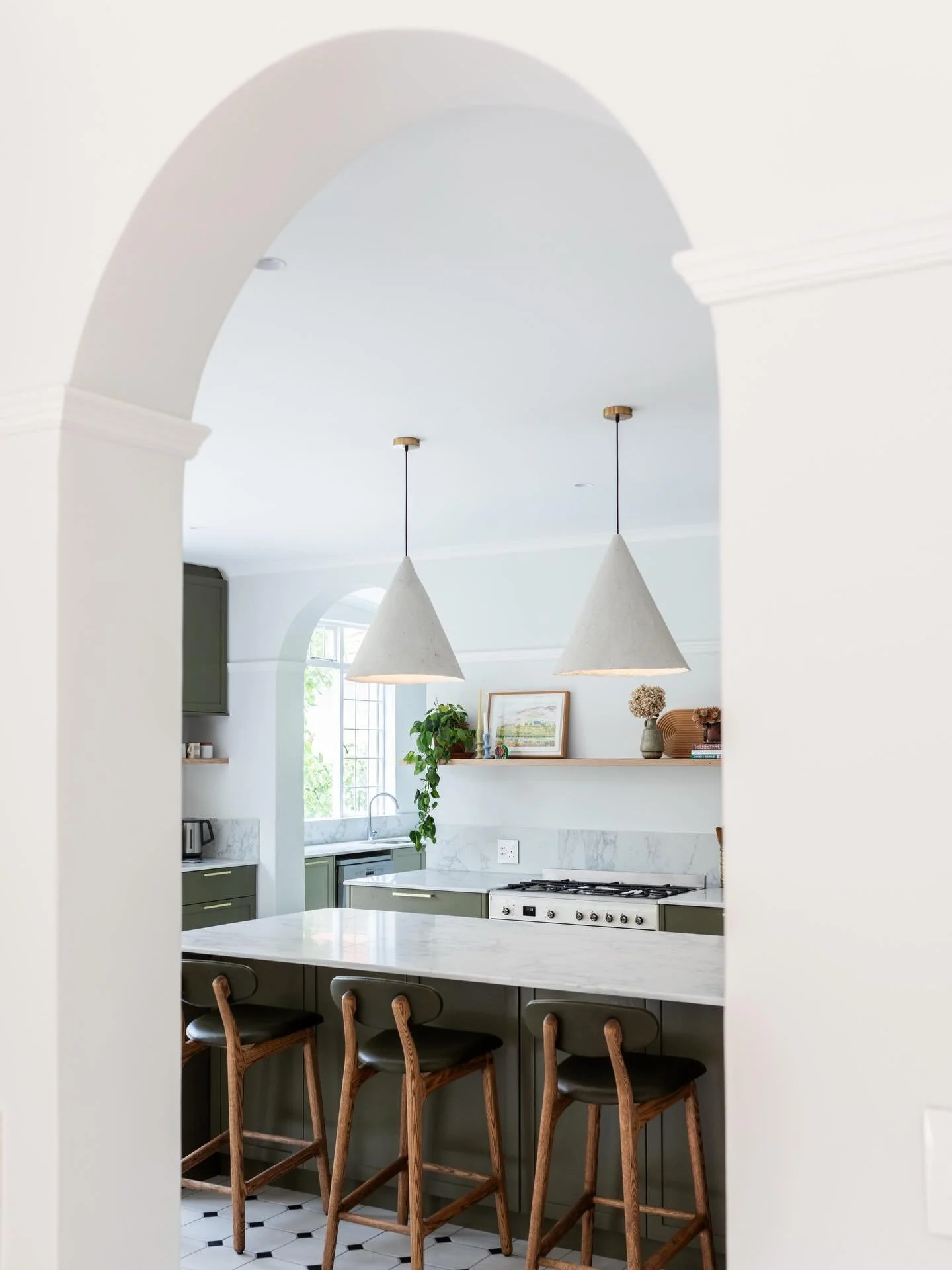 A peek through the arch into the charming Victorian kitchen at House R 🤍

Picture rails and graceful arches have been thoughtfully added and retained, celebrating the homes heritage while elevating it for modern family living 🤍

Captured by @vinylr