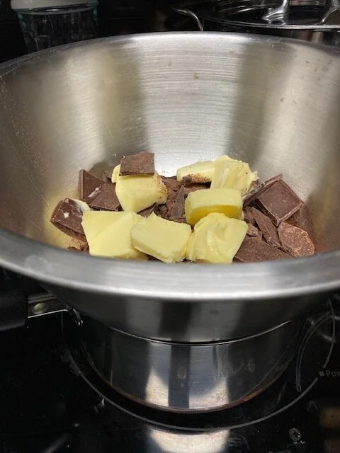 1. Hello! If you’re here you have one of our brownie mix packs in your hands. To start, I like to use a water bath (bain-marie) to melt the chocolate and butter cut into chunks together. But! you could also melt it in a microwave (in a microwave saf…