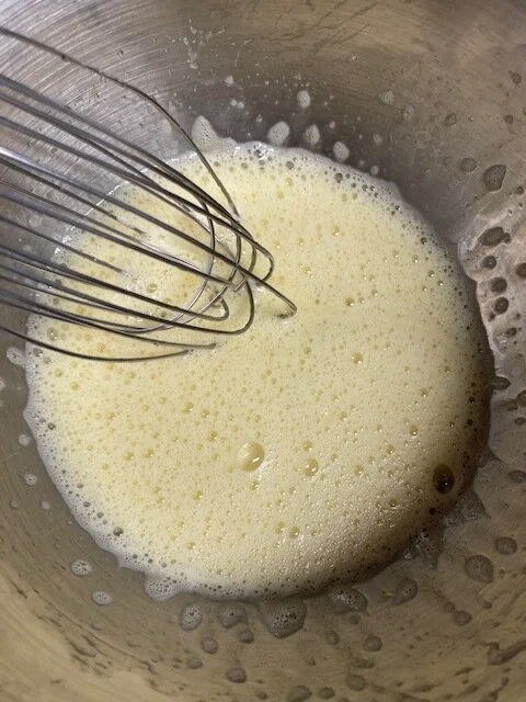 2. Here you are mixing the eggs and sugar together! You can warm up your wrist of steel and whip it by hand with a whisk, or use an electric beater. You choose. As I said I do things the hard way too often so I’m muscle powering it. You want to get …