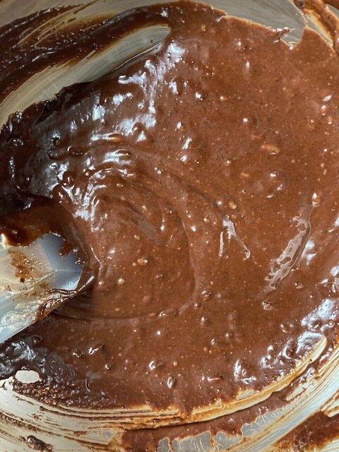 6. Phew you made it past the hardest part! The brownie batter came together smoothly! You see it is shiny, thick, and happy.