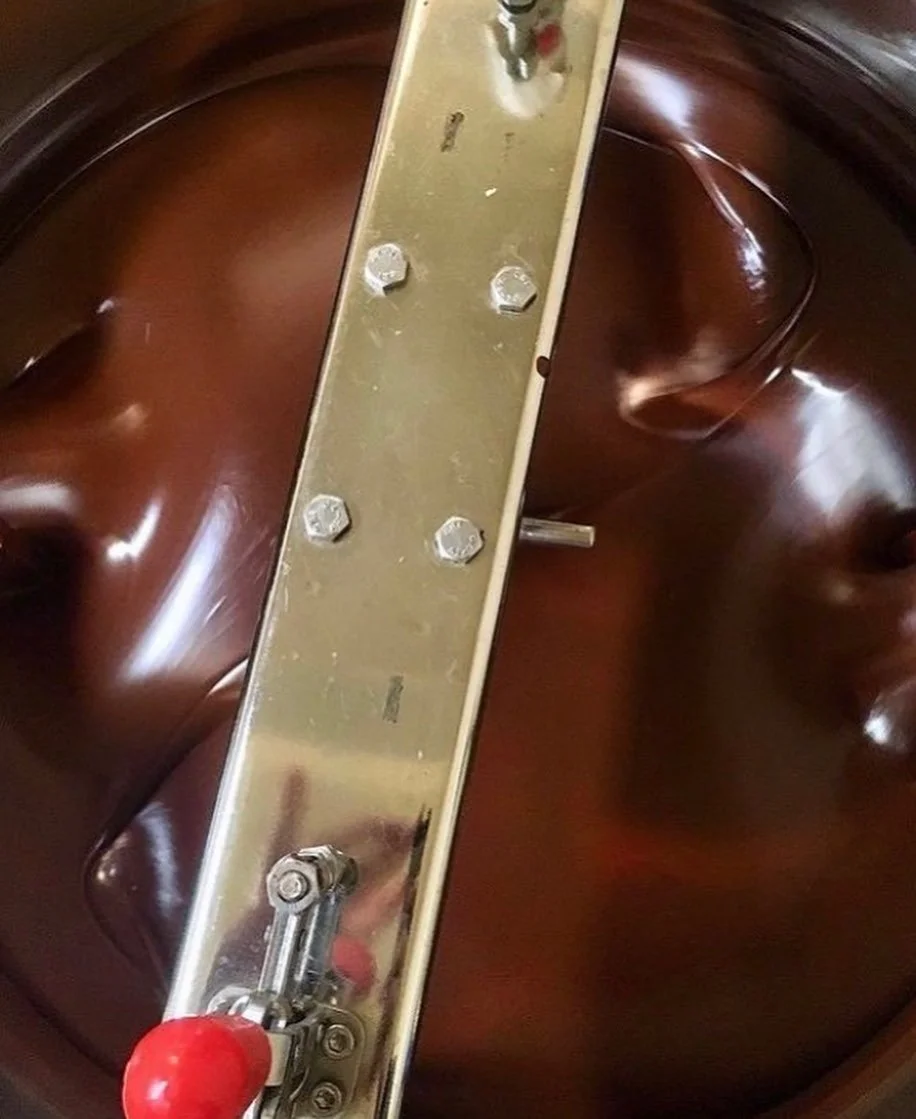  The melanger from above with chocolate grinding smoothly inside of it.  